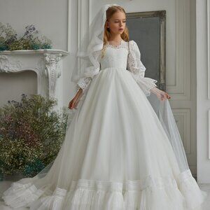 Elegant white lace dress with puffy sleeves. A gorgeous communion dress
